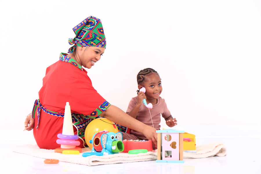 Nanny and child playing happily